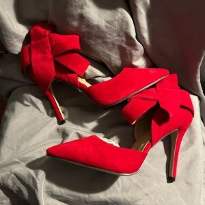 Red velvet heels with ankle strap and bow
